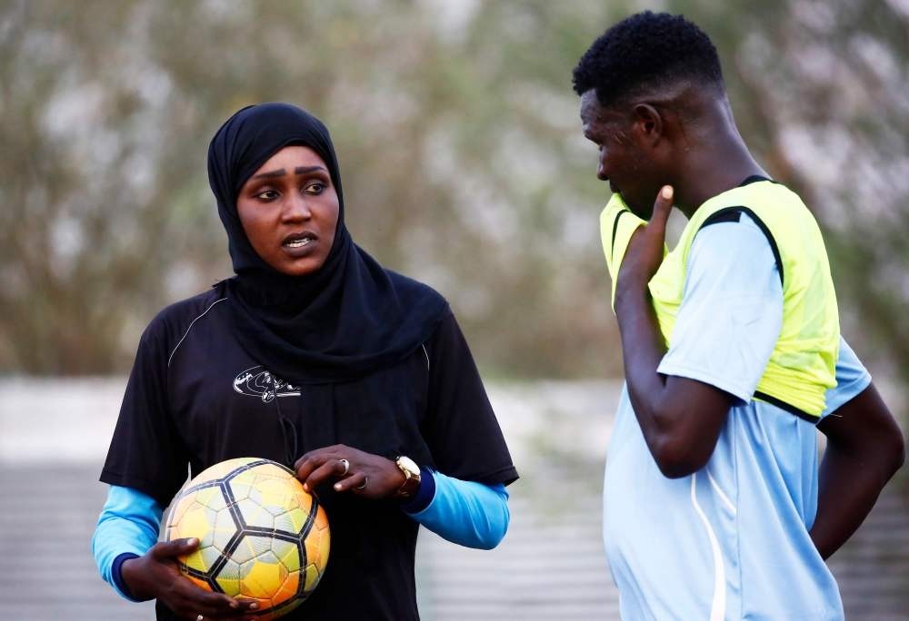 Salma al-Majidi, acknowledged by FIFA as the first Arab and Sudanese woman to coach a men's football team in the Arab world, instructs the Al-Ahly Al-Gadaref club during a training session in the town of Gedaref, east of Khartoum.