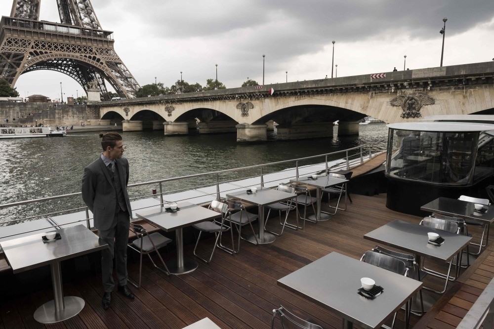 A waiter stands at French chef Alain Ducasse's new boat restaurant, the ,Ducasse sur Seine.,