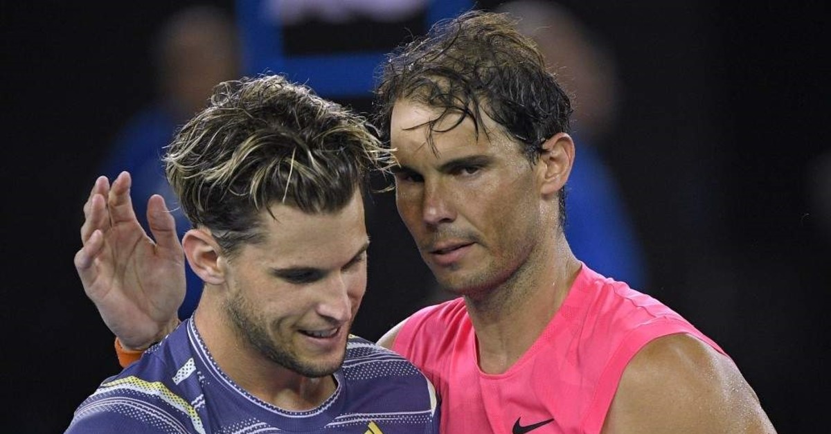 Austria's Dominic Thiem (L) is congratulated by Spain's Rafael Nadal after winning their quarterfinal match at the Australian Open tennis championship in Melbourne, Australia, Wednesday, Jan. 29, 2020. (AP Photo)