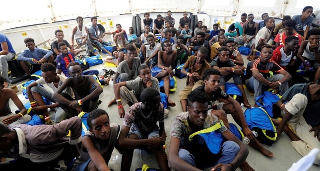 Migrants rest after being rescued by SOS Mediterranee organisation and Doctors Without Borders during a search and rescue (SAR) operation with the MV Aquarius rescue ship in the Mediterranean Sea, August 10, 2018. (REUTERS Photo)