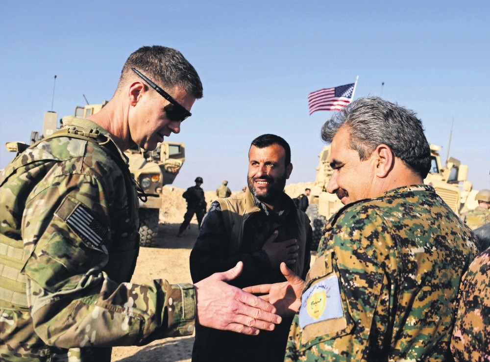 U.S. General Jamie Jarrard (L) thanks a YPG commander near the town of Manbij, northern Syria, Feb. 7, 2018. 