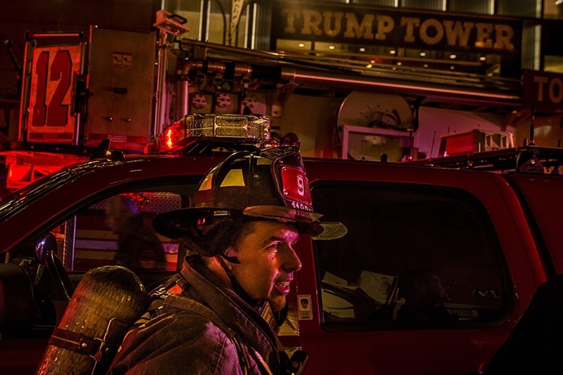 A firefighter works in front of Trump Tower after a fire in New York (AP Photo)