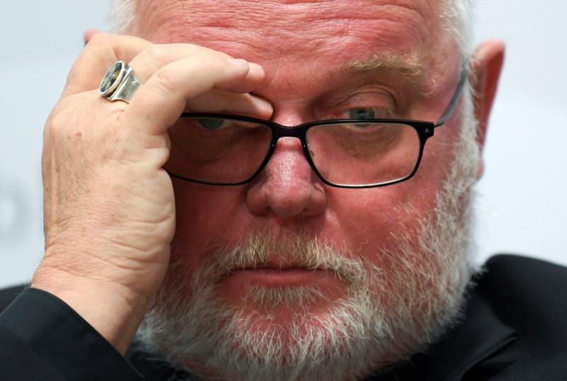 Cardinal Reinhard Marx, head of the german bishops' conference, ponders during a press conference on a report on sexual abuse of minors within the German Catholic Church in central Germany, Sept. 25, 2018.  (AP Photo)