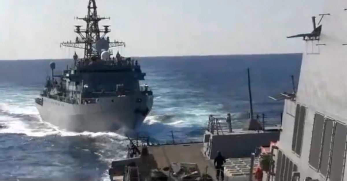This photo provided bythe U.S. 5th Fleet, shows a Russian Navy ship approaching an American warship in the North Arabian Sea, on Thursday, Jan. 9, 2020. (U.S. 5th Fleet via AP)