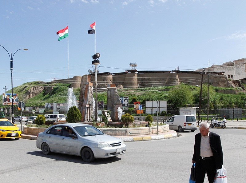 The Kurdish flag and the Iraqi flag are seen on a building in Kirkuk, Iraq, April 6, 2017 (Reuters Photo)