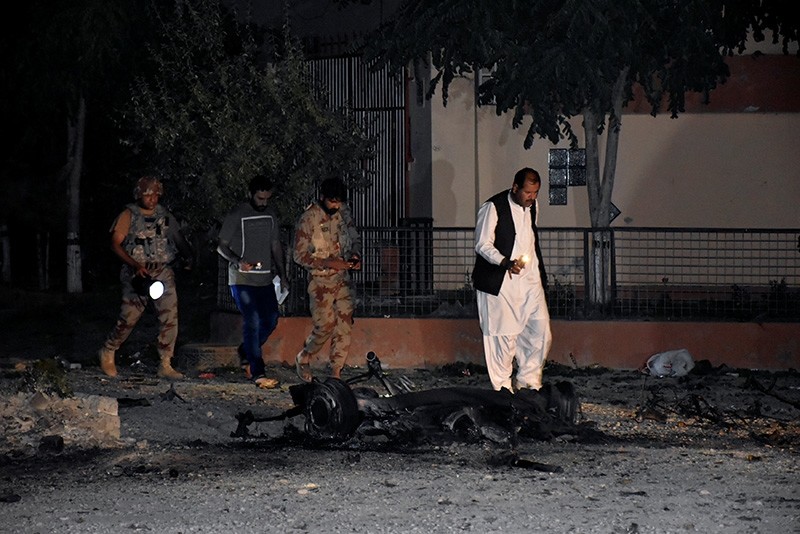 Security officers and paramilitary soldiers survey the site, after five suicide bombers tried to drive a vehicle laden with ammunition and explosives into a military facility in Quetta, Pakistan May 17, 2018. (Reuters Photo)
