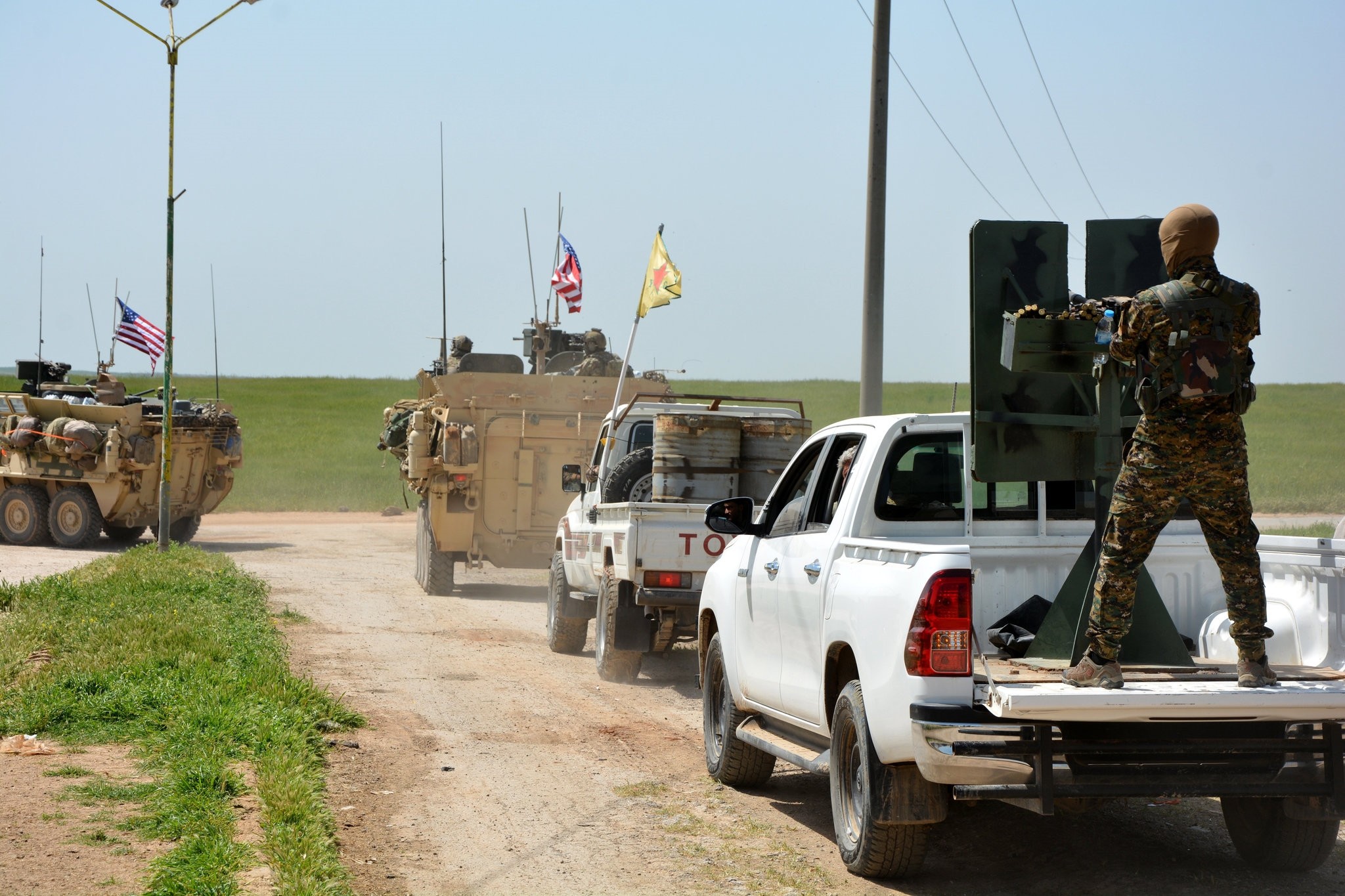 A convoy of U.S. army troops and the Kurdish terrorist group of the People's Protection Units (YPG), a PKK extension, patroling near the Syrian town of al-Darbasiyah at the Syrian-Turkish border, April 29. (FILE Photo)