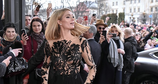 US model, businesswoman and socialite Paris Hilton (C) arrives to the Grand Hotel in Lviv, Western Ukraine, March 31, 2018. (EPA Photo)