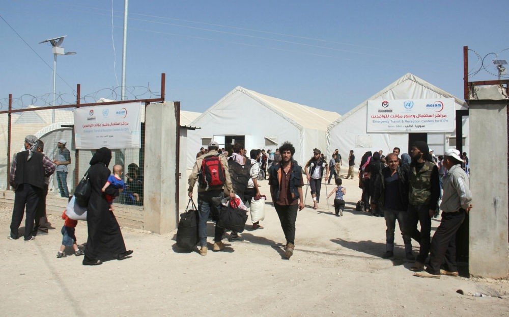 Syrian civilians who were evacuated from the Qabun district in northeast Damascus, arrive at a temporary camp in the northern countryside of Idlib province on May 15.