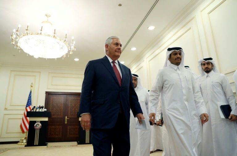 US Secretary of State Rex Tillerson and Qatari Foreign Minister Mohammed bin Abdulrahman Al-Thani (2nd-R) leave a press conference in Doha on October 22, 2017 (AFP Photo)