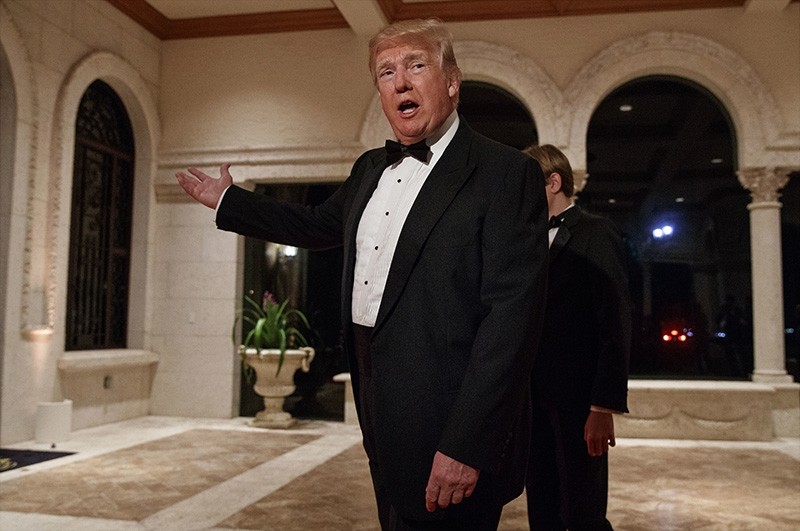 In this Sunday, Dec. 31, 2017 file photo, President Donald Trump speaks with reporters as he arrives for a New Year's Eve gala at his Mar-a-Lago resort, in Palm Beach, Fla. (AP Photo)
