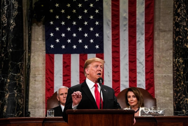 U.S. President Donald Trump delivers the State of the Union address, alongside Vice President Mike Pence and Speaker of the House Nancy Pelosi, at the US Capitol in Washington, DC, on February 5, 2019. (AFP Photo)