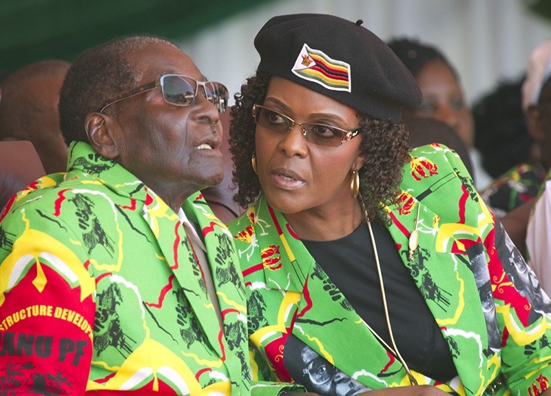 In this June, 2, 2017 file photo Zimbabwean President Robert Mugabe, left, and his wife Grace follow proceedings during a youth rally in Marondera Zimbabwe (AP Photo)