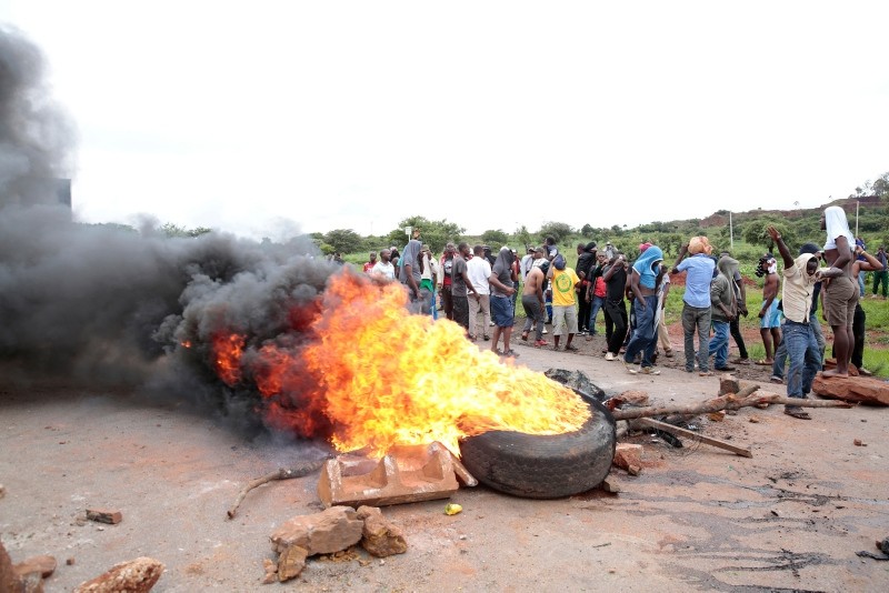 Protestors burn tires during a demonstration over the recent fuel price increase and the rising cost of living in the high-density suburb of Warren Park, Harare, Zimbabwe, Jan. 15, 2019. (EPA-EFE Photo)