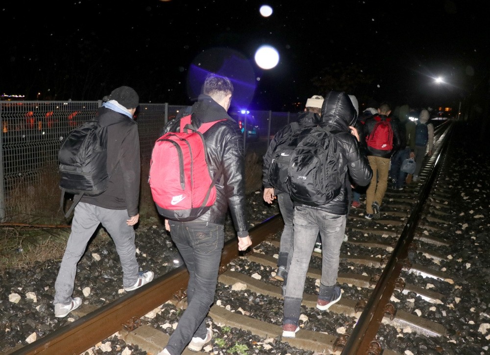 Migrants walk on train tracks near the Turkish-Greece border in Edirne. Edirne has seen an influx of migrants choosing the land route to Europe in recent months.