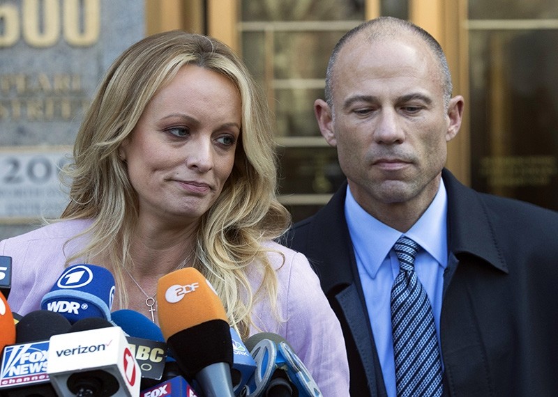 In this April 16, 2018, file photo, adult film actress Stormy Daniels, left, stands with her lawyer Michael Avenatti as she speaks outside federal court in New York. (AP Photo)