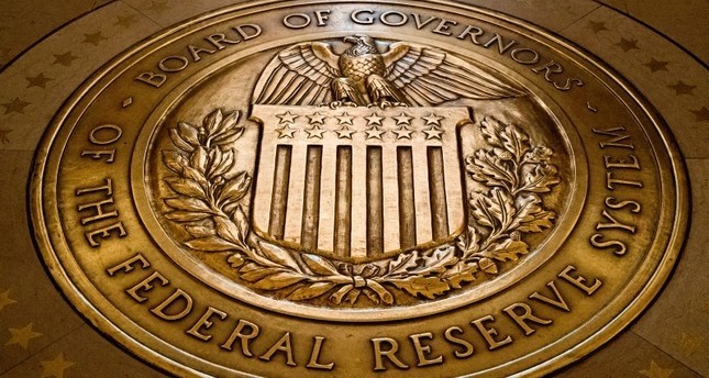 In this Feb. 5, 2018, file photo, the seal of the Board of Governors of the United States Federal Reserve System is displayed in the ground at the Marriner S. Eccles Federal Reserve Board Building in Washington. (AP Photo)