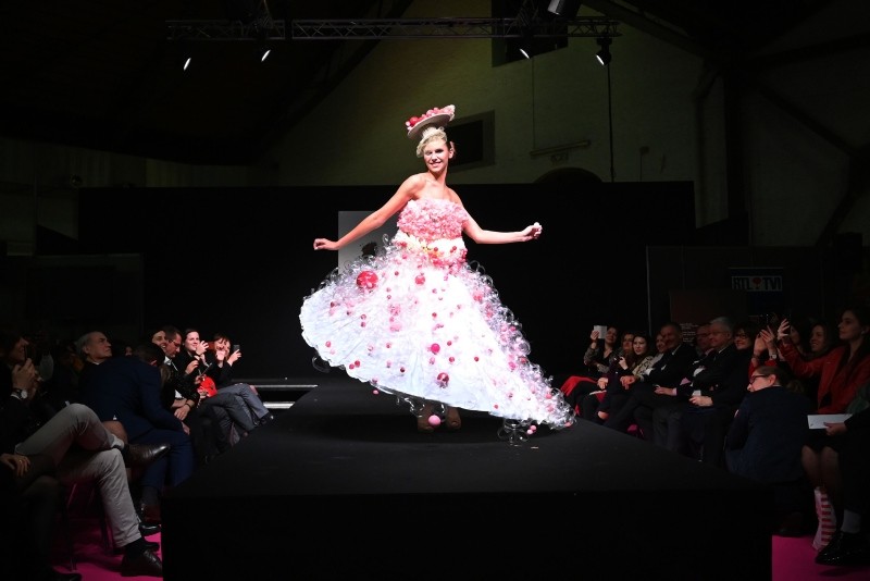 A model presents a chocolate-made dress creation during a fashion show of clothes made out of chocolate for the inaugural night of the sixth Chocolate Fair in Brussels, on February 21, 2019. 