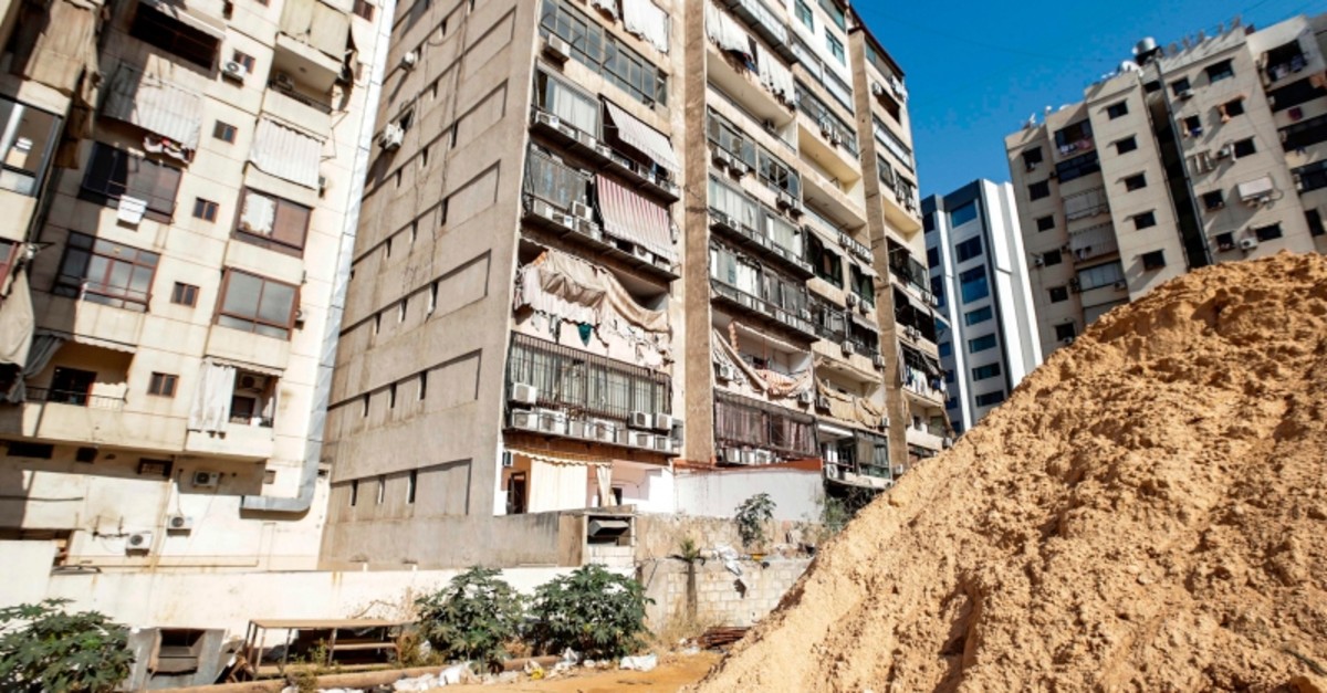 This picture taken on August 25, 2019 shows damage to a building housing a media center of the Lebanese Shiite group Hezbollah in the south of the capital Beirut, after two drones came down in its vicinity earlier in the day. (AFP Photo)