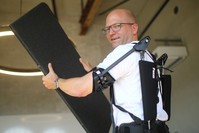 Soenke Rossing, Head of Industrials unit at German prosthetic limb maker Ottobock, presents an exoskeleton of the company during an interview with Reuters in Berlin, Germany, August 23, 2018. (Reuters)