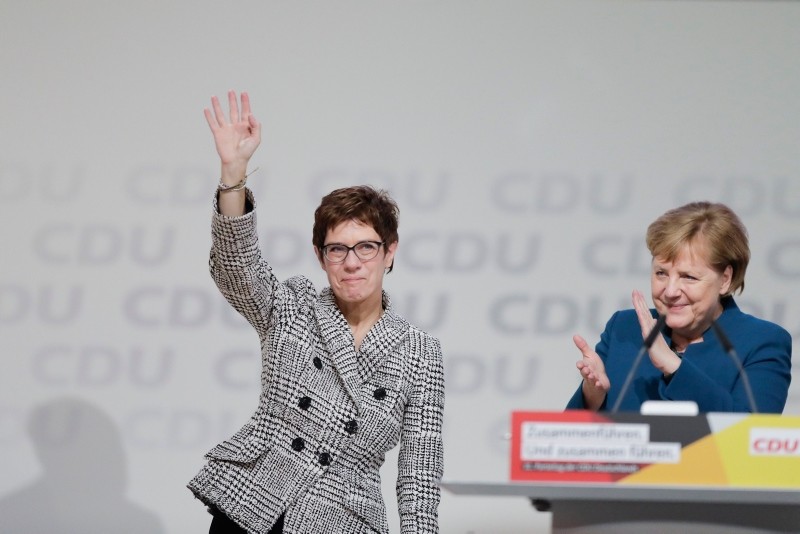 German Chancellor Angela Merkel, right, congratulates newly elected party chairwoman Annegret Kramp-Karrenbauer after the election at the party convention of the CDU in Hamburg, Germany, Friday, Dec. 7, 2018. (AP Photo)