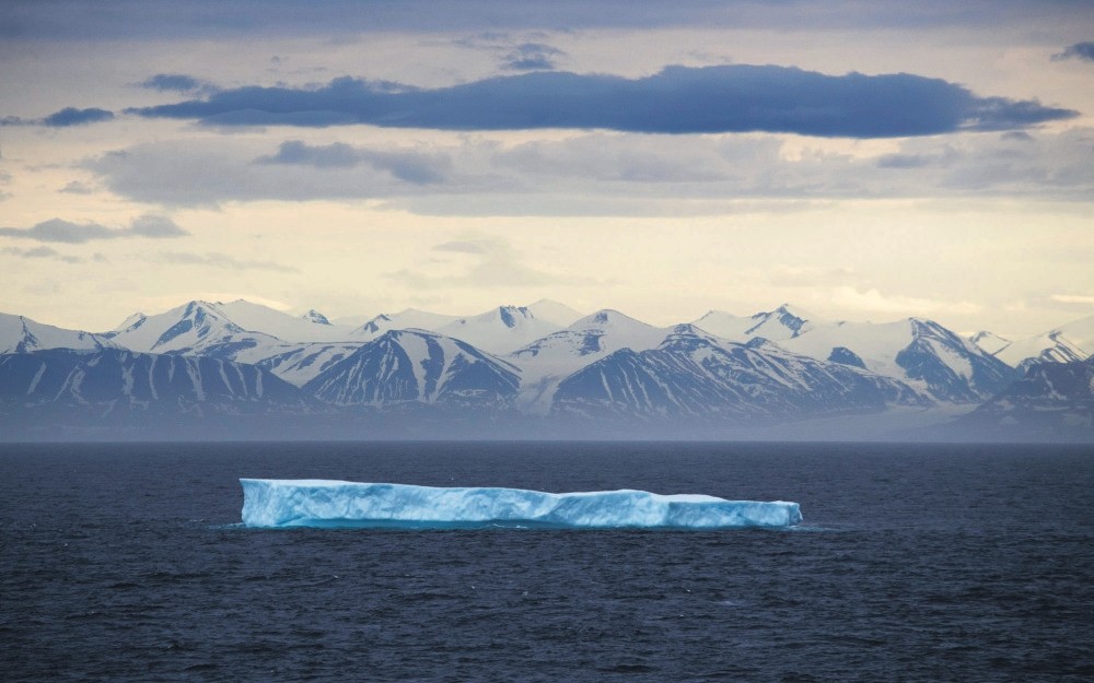 An iceberg floats past Bylot Island in the Canadian Arctic Archipelago.