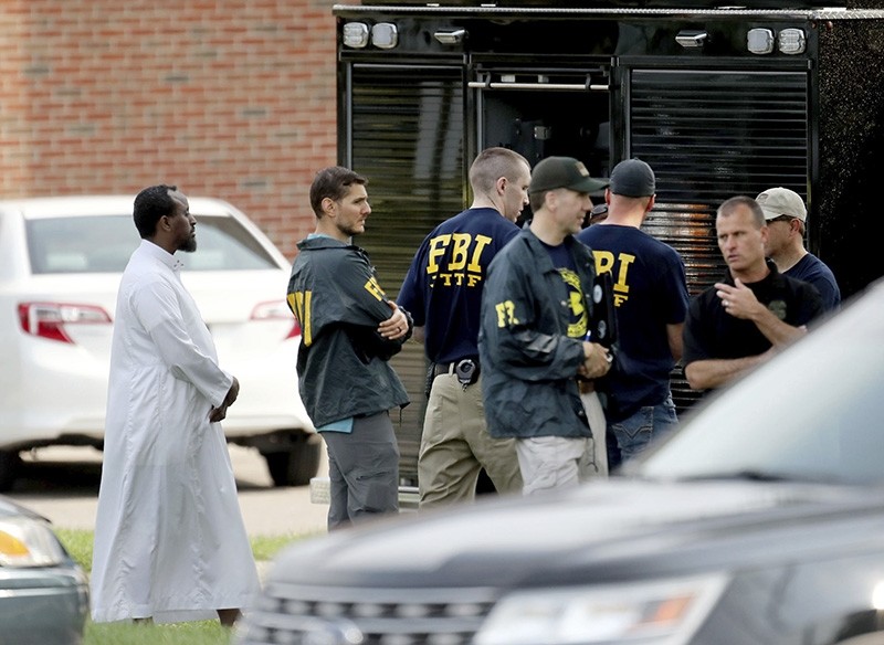  In this Aug. 15, 2017 file photo, Law enforcement officials investigate an explosion at the Dar Al-Farooq Islamic Center in Bloomington, Minn. (AP Photo)