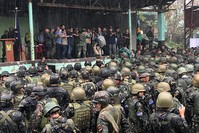 Philippine President Rodrigo Duterte, center, is joined by other government and military officials as they visit troops in Marawi, southern Philippines on Tuesday Oct. 17, 2017 (AP Photo)