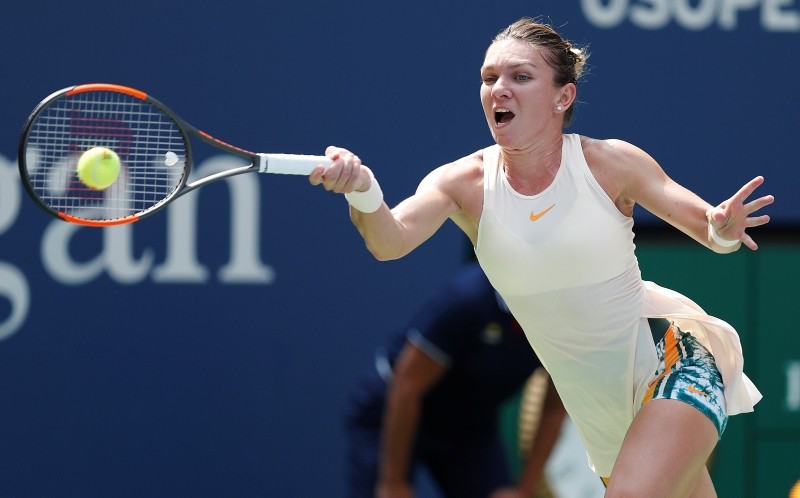 Simona Halep of Romania hits a return to Kaia Kanepi of Estonia during the first day of the US Open Tennis Championships, in New York, USA, 27 August 2018. (EPA Photo)