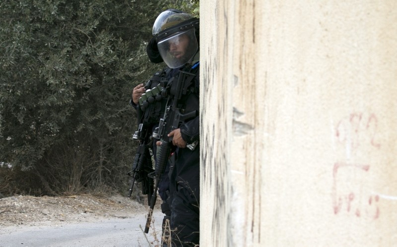 Israeli forces stand guard in the village of Shuwaykah where the man who shot dead two Israelis earlier used to live, in the occupied west bank, on October 7, 2018. (AFP Photo)