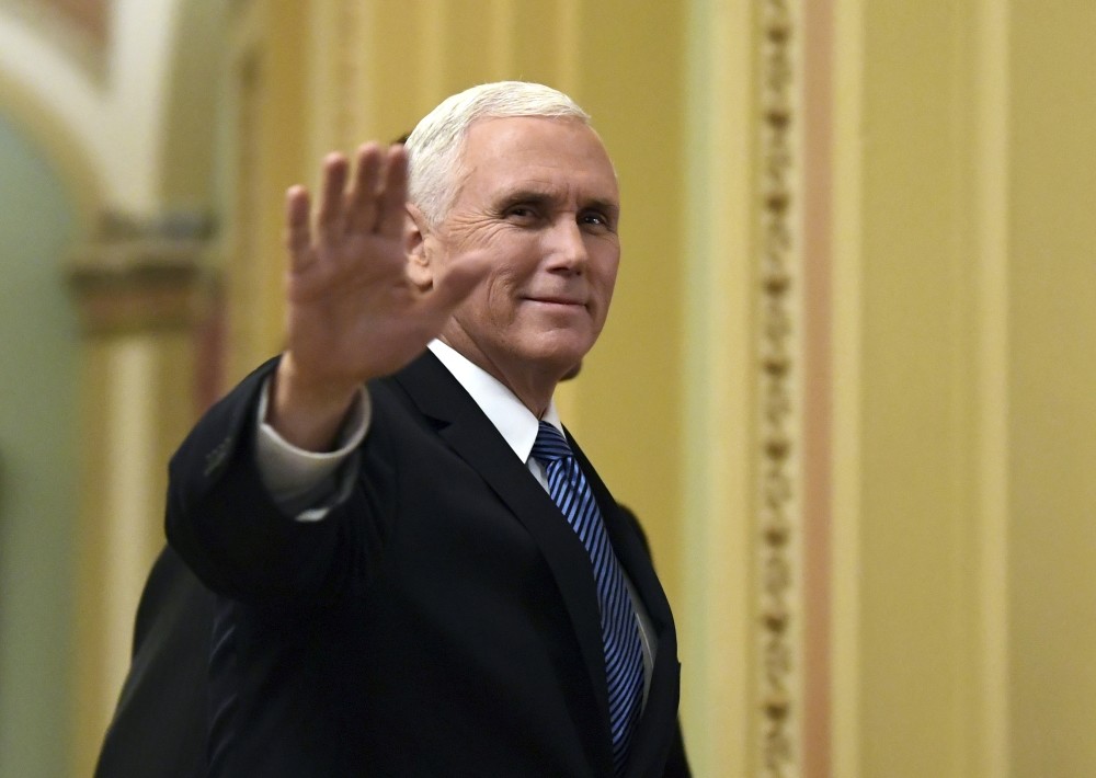 U.S. Vice President Mike Pence waves as he walks on Capitol Hill, Washington, Jan. 3. Pence is going to visit Egypt next week as part of a trip to the Middle East to discuss regional developments and the future of U.S.-Egyptian ties.