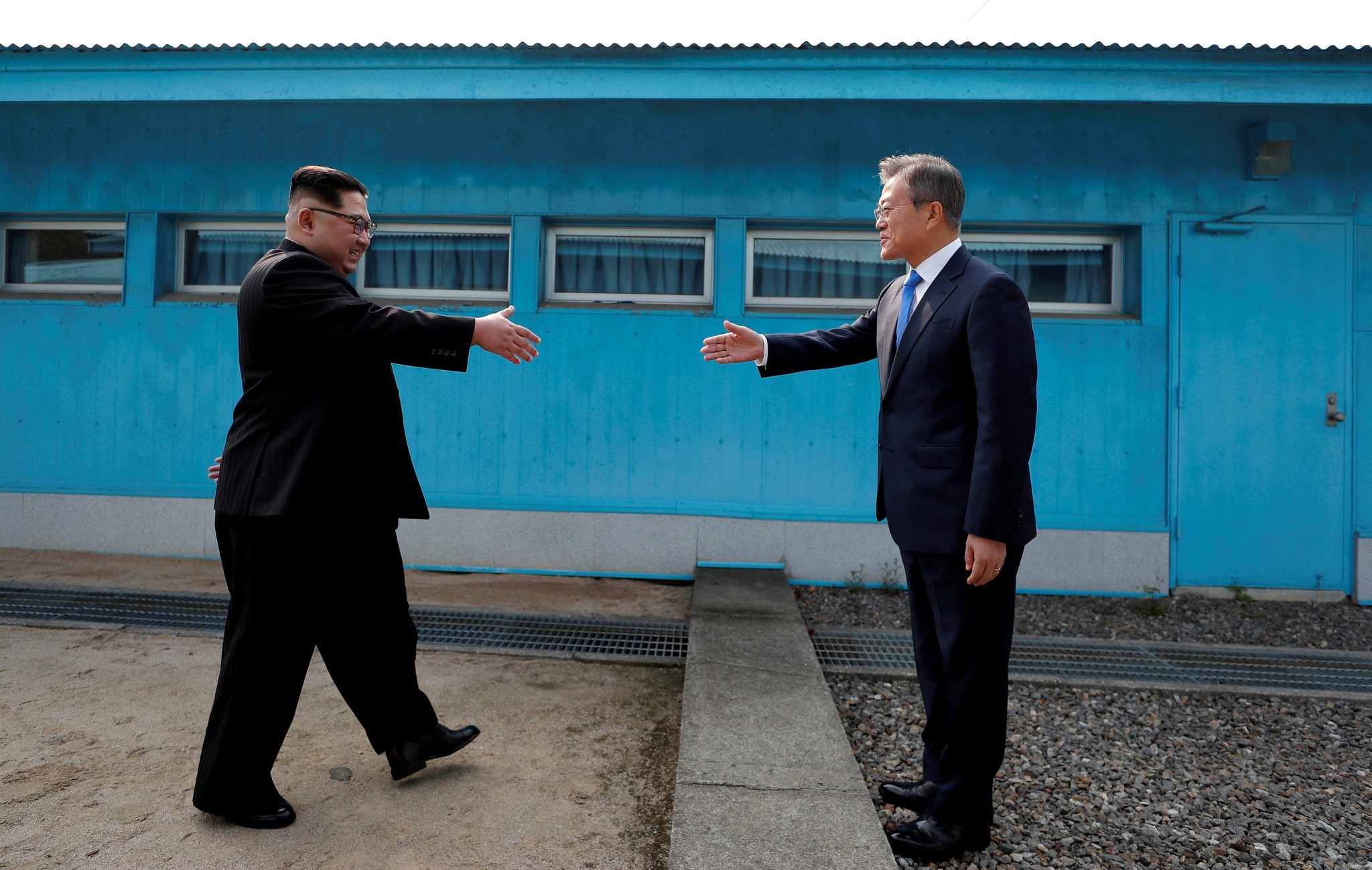 North Korean leader Kim Jong-un and  South Korean President Moon Jae-in shake hands at the truce village of Panmunjom inside the Demilitarized Zone separating the two Koreas, April 27. 