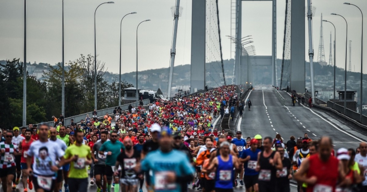 Participants run on the July 15 Martyrs' Bridge, known as the Bosphorus Bridge, during the 39th annual Istanbul Marathon on November 12, 2017, in Istanbul. (AFP Photo)