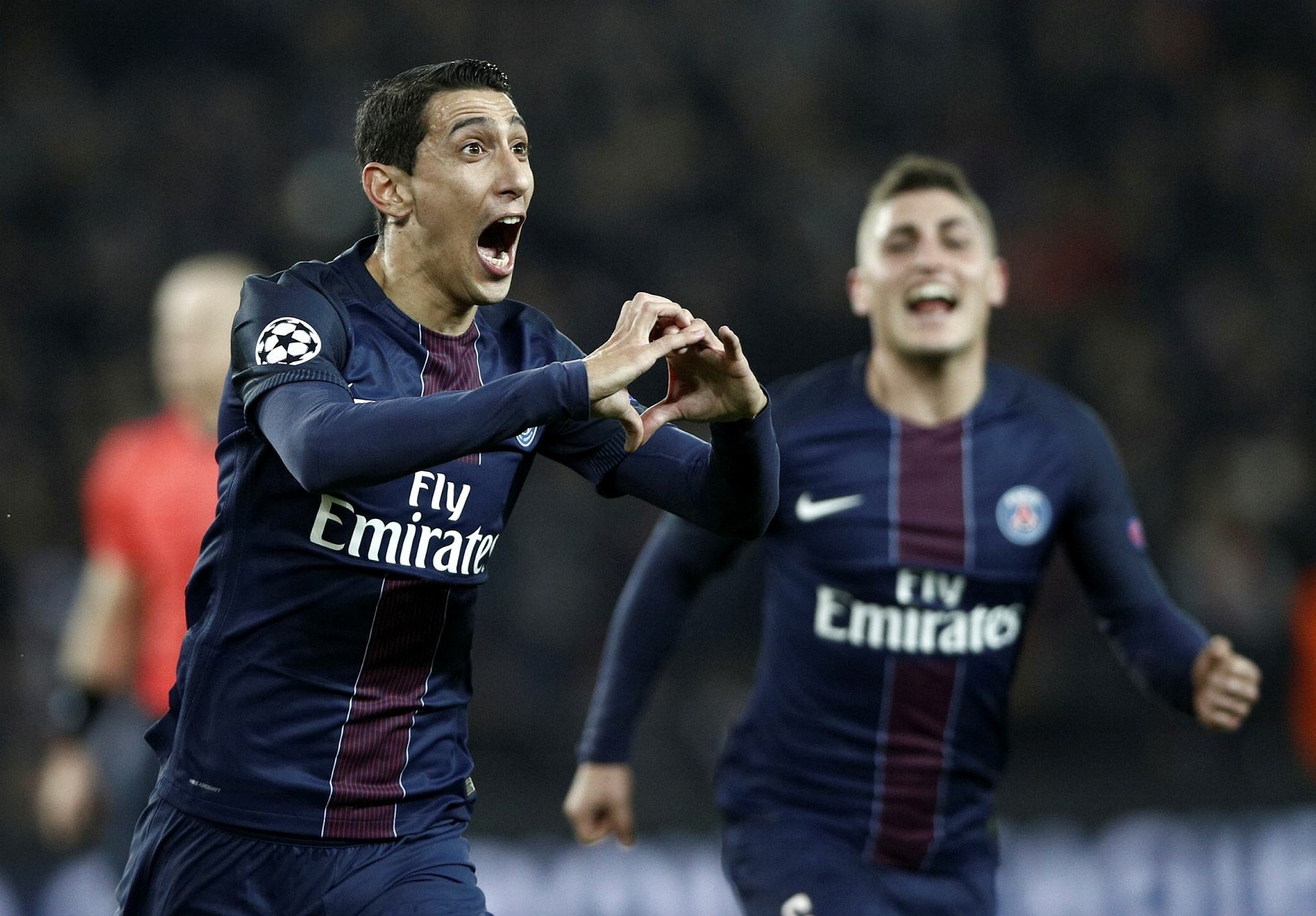 PSG's Angel Di Maria (L) celebrates after scoring the 1-0 lead during the UEFA Champions League round of 16 first leg soccer match between Paris Saint Germain and FC Barcelona at the Parc des Princes Stadium, in Paris, France (EPA Photo)