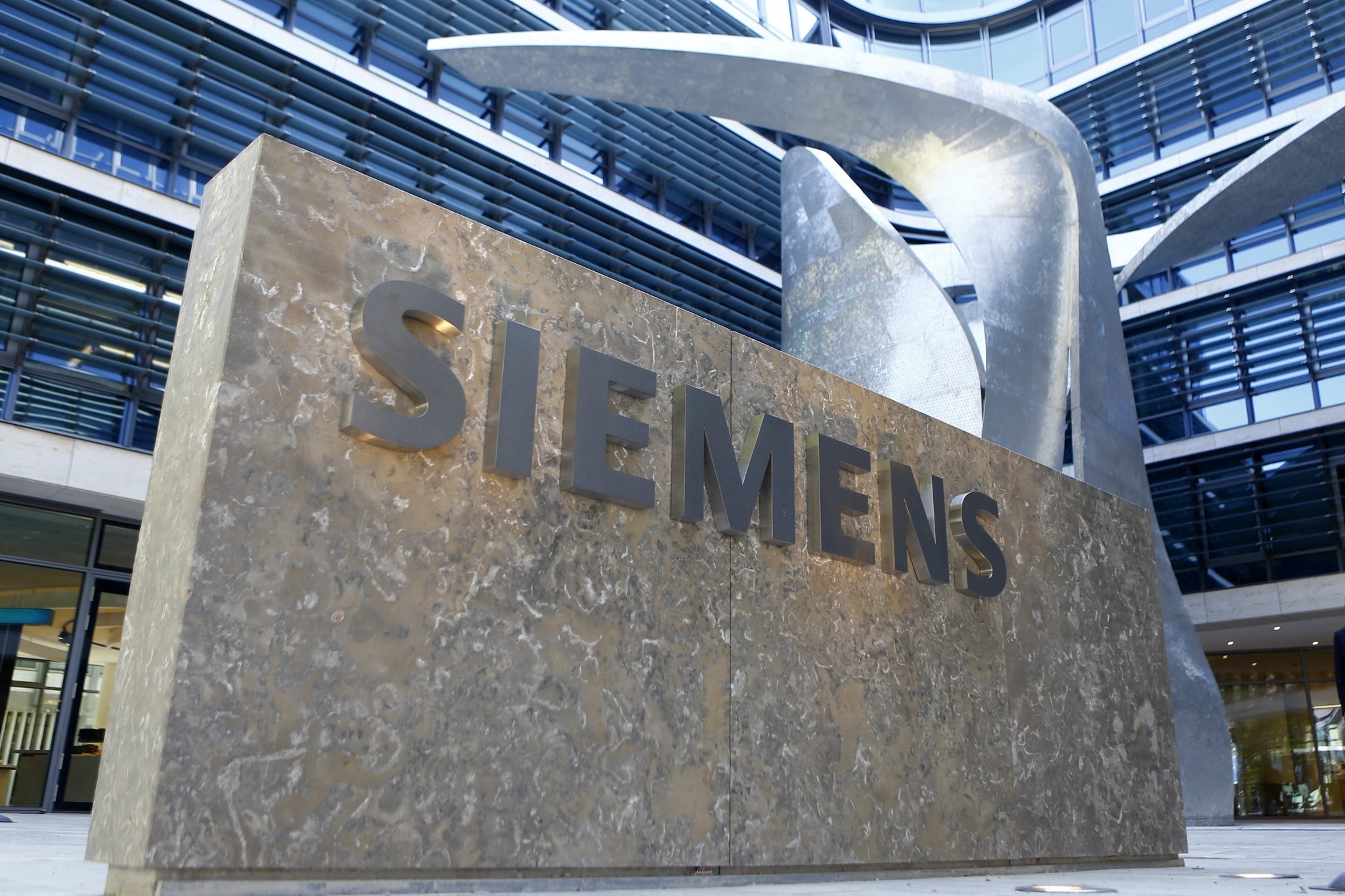 In this June 24, 2016 file photo the logo of German industrial conglomerate Siemens is pictured prior to the opening ceremony at the new headquarters in Munich, Germany. (AP Photo)
