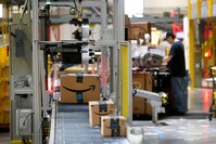 In this Aug. 3, 2017, file photo, packages pass through a scanner at an Amazon fulfillment center in Baltimore. (AP Photo)