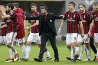 AC Milan coach Gennaro Gattuso celebrates with his players after winning the Serie A match against Chievo Verona at the San Siro stadium in March 18 in Milan.