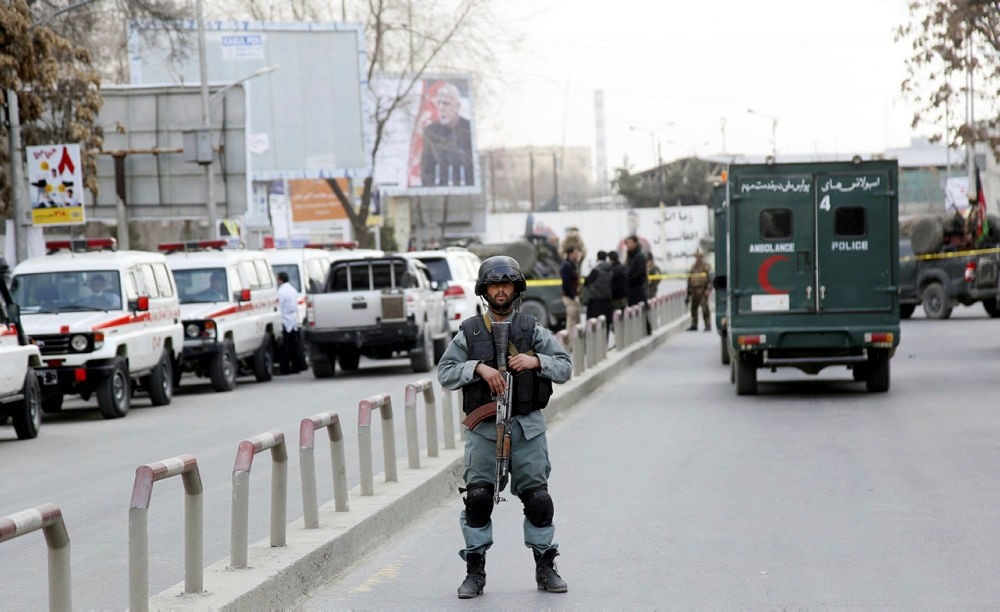 An armed Afghan security official secures the surroundings of the Sardar Daud Khan's Hospital, also known as Kabul Military Hospital.  (EPA Photo)