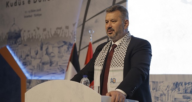 AK Party Istanbul deputy and Turkey-Palestine Inter-Parliamentary Friendship Group Chairman Hasan Turan speaks at the International Conference on the Muslim Ummah in Istanbul on Oct. 14, 2018. (AA Photo)