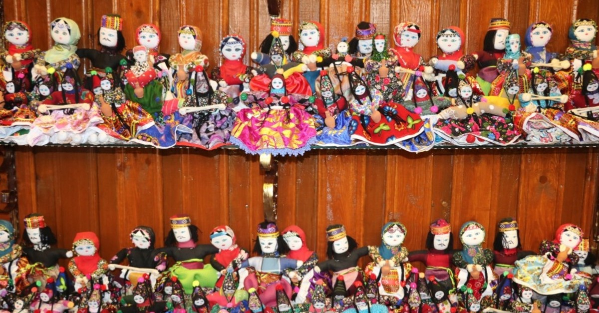 Ezo Gelin dolls stand out with their traditional clothing.