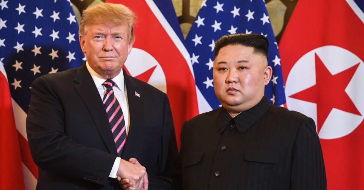 US President Donald Trump, left, shakes hands with North Korea's leader Kim Jong Un before a meeting at the Sofitel Legend Metropole hotel in Hanoi, Vietnam, Feb. 27, 2019. (AFP Photo)