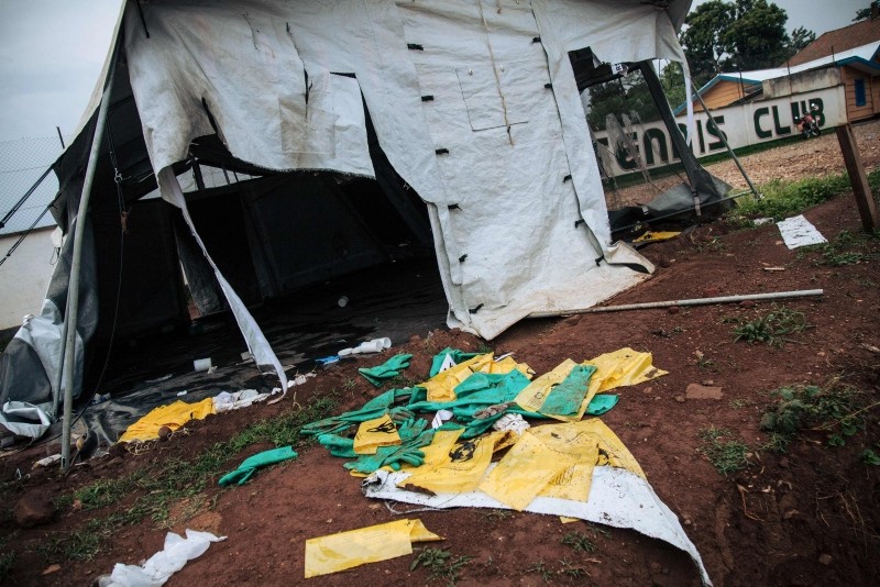 Picture taken on Dec. 27, 2018 shows protective equipment for Ebola care left on the ground next to ransacked tents by demonstrators at the Ebola transit center in Beni, following a demonstration against the postponement of elections. (AFP Photo)