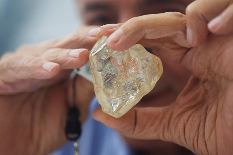 A 709-carat diamond, found in Sierra Leone and known as the ,Peace Diamond,, is displayed during a tour ahead of its auction (Reuters File Photo)