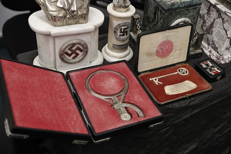 Detail of artifacts bearing Nazi symbols that were recovered by the Argentine Federal Police (PFA), displayed at the headquarters of the Delegation of Argentinean Israeli Associations in Buenos Aires, Argentina, 19 June 2017. (EPA Photo)