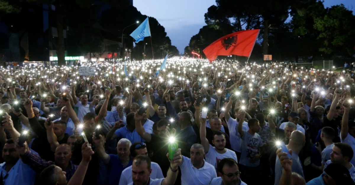 Opposition supporters use light from their cellphones during an anti-government protest, calling on Prime Minister Edi Rama to step down, in Tirana, Albania, June 8, 2019. (Reuters Photo)