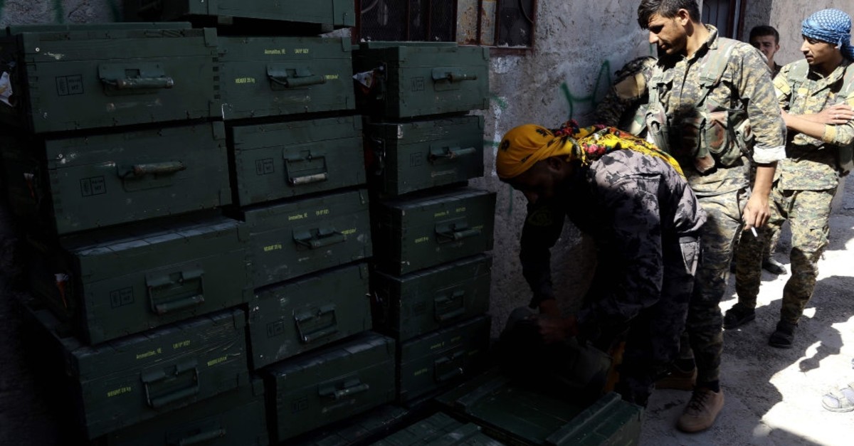 YPG terrorists unload boxes of ammunition supplied by the U.S.-led coalition, Raqqa, June 7, 2019.