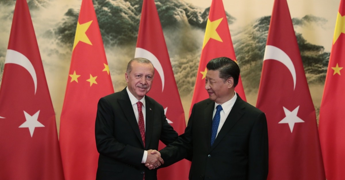 President Recep Tayyip Erdou011fan and Chinese President Xi Jinping shake hands before a meeting on Turkey-China bilateral relations, Beijing, July 2, 2019.