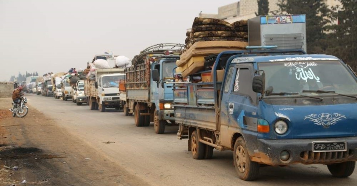 Trucks carry belongings of people fleeing from Maarat al-Numan, in northern Idlib, Dec. 24, 2019. (Reuters Photo)