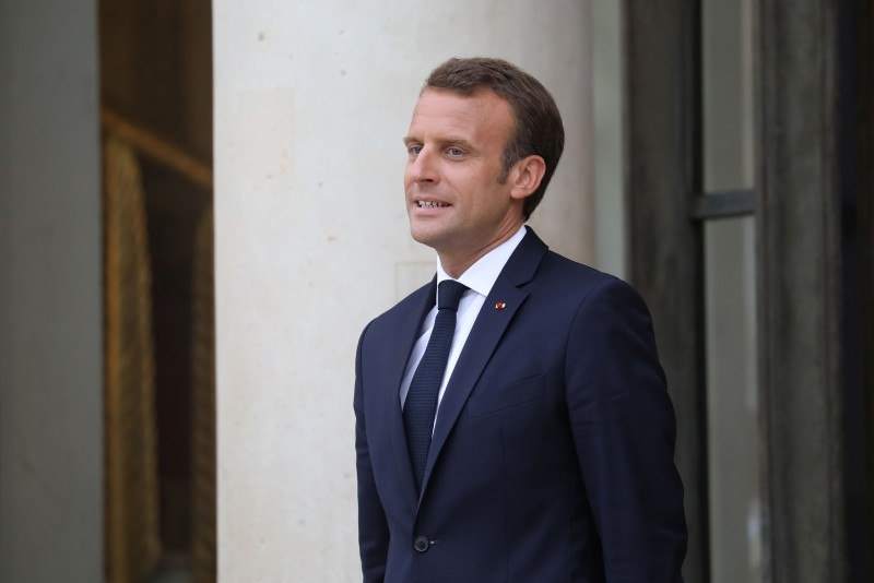 French President Emmanuel Macron stands at the entrance after a meeting with Israeli Prime Minister at the Elysee Palace in Paris, on June 5, 2018. (AFP Photo)