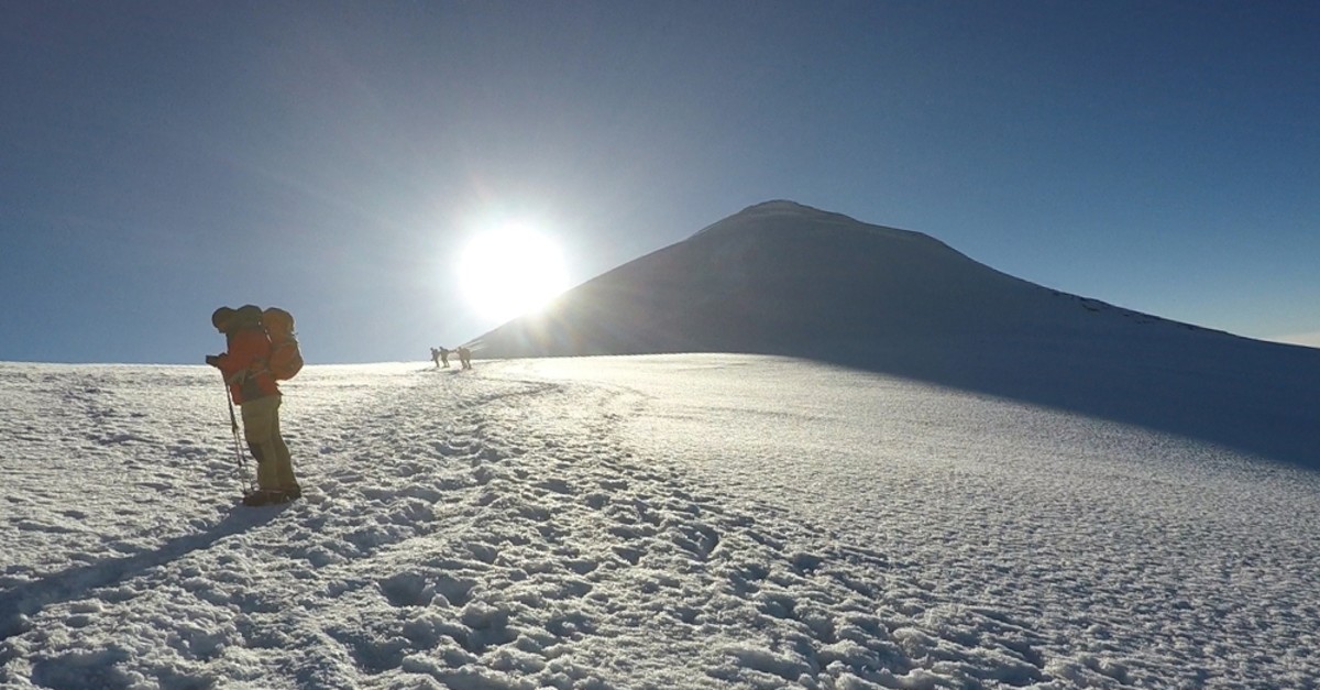 While the summit of Mt. Au011fru0131 is covered with snow, the foothills of the mountain showcase the autumn at its best.